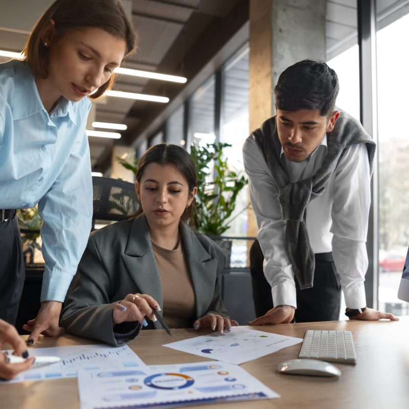 people-analyzing-checking-finance-graphs-office